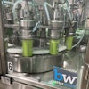 Twelve-head rotary filling is immediately followed by a three-head seamer for low oxygen pickup.