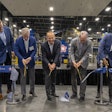 In March, Republic Services celebrated the official opening of the Polymer Center-Blue Polymers complex in Indianapolis with a ribbon cutting ceremony. At far left is Pete Keller, at center (seventh from left) is Jon Vander Ark.