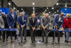 In March, Republic Services celebrated the official opening of the Polymer Center-Blue Polymers complex in Indianapolis with a ribbon cutting ceremony. At far left is Pete Keller, at center (seventh from left) is Jon Vander Ark.
