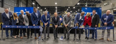 In March, Republic Services celebrated the official opening of the Polymer Center-Blue Polymers complex in Indianapolis with a ribbon cutting ceremony. At far left is Pete Keller, at center (seventh from left) is Jon Vander Ark.