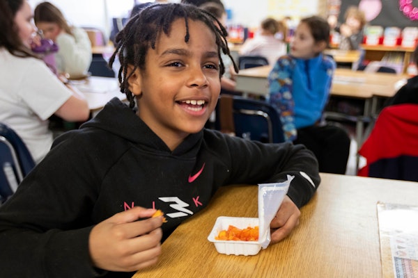 The product combination features a 4-ounce molded fiber cup made with renewable resources, which is sealed with plant-based lidding film once food, typically cut fruit or vegetables, has been placed inside.