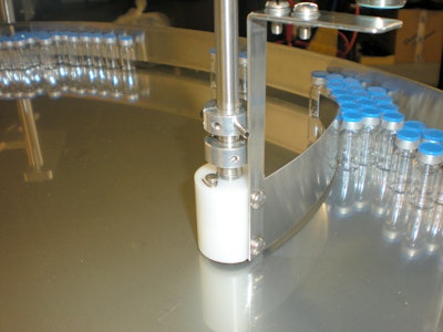 Pharmafill TT series powered turntables orient, load bottles, jars onto conveyor for packaging.