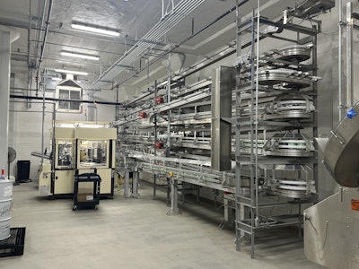 A Dyco Inc. staging area holds assembled cartons before they are sent to filling.