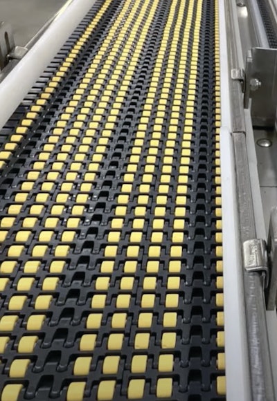 Photo A: This overhead section uses low-backpressure roller-top belting to provide a crucial 200 feet or so of accumulation space.