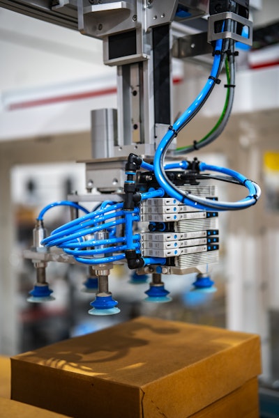 Festo VTUX compact valve manifolds, center, are placed on the end of arm tool for higher performance. VTUX features integrated vacuum with sensors for minimum energy consumption.