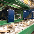 A stream of recycled waste, mostly packaging, enters Glacier's AI-supported robotic sortation equipment.