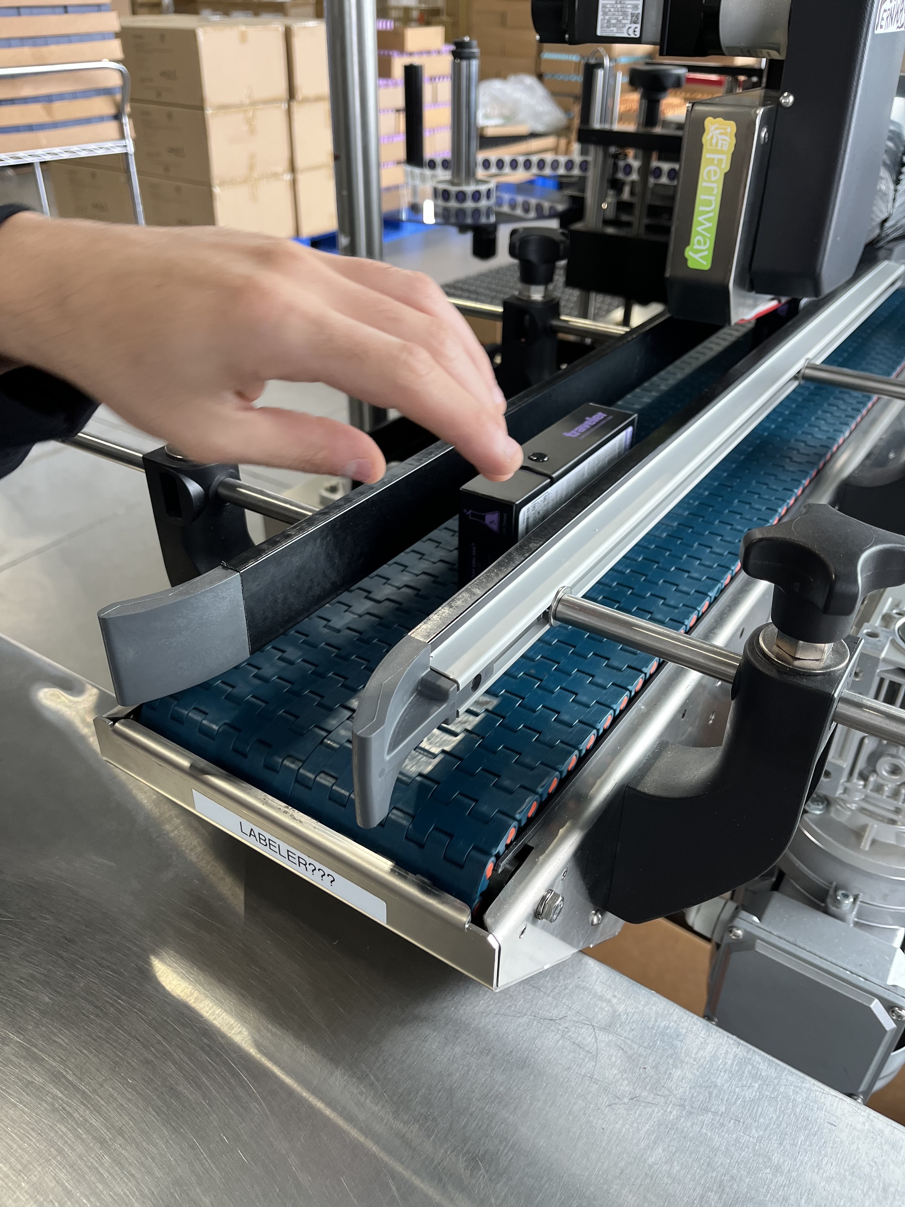 Fernway&rsquo;s Paxiom dual-head labeler applies regulatory and branding labels to opposite sides of premium cartons at up to 40 per minute.