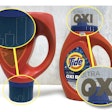 Tide’s polypropylene caps undergo LaserSharp marking on two sides. On the left, we see an inverted bottle where Tide’s blue detergent is completely filling the dosing cap. Fill-level guidelines are visible both when detergent is in the cap as pictured, and when the cap is empty. On the upper right, we see the OXI logo on the other side of the cap. This branding/logo was also marked on the cap in the LaserSharp process.