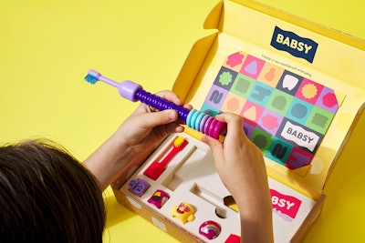 The packaging design for the Build-A-Brush encourages play, and is also scalable for future starter kits, brush heads, and expansion packs.
