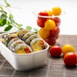 Paper-based containers coated with PHA provide a compostable alternative to conventional plastic linings, delivering grease and moisture resistance for foods like sushi, produce, and ready-to-eat meals.