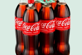 Instead of shrink film, the bottles are held together using strategically placed adhesive dots, paired with a recyclable cardboard handle for carrying.