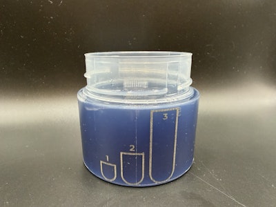 Fill line indicators in a cap that's filled with detergent.