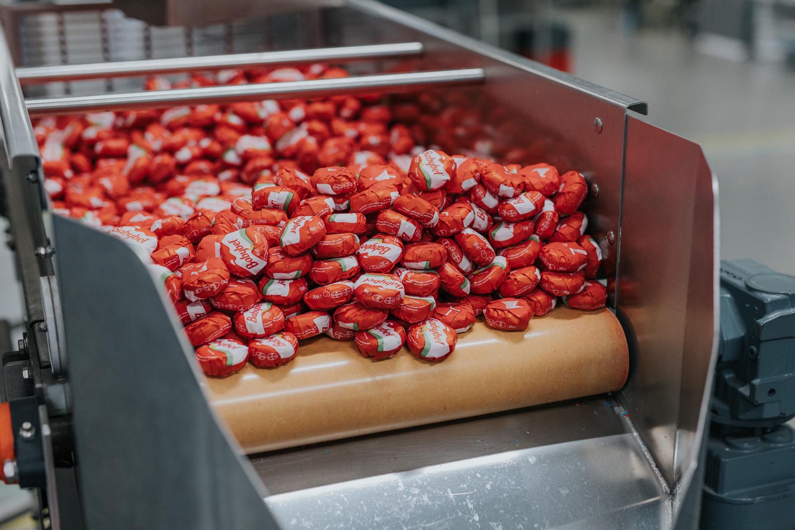 High-volume production runs highlight the scale of Babybel&rsquo;s global transition from cellophane to paper packaging.