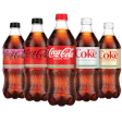Five Coca-Cola bottles in different varieties lined up side by side