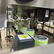 Industrial packaging machine filling green Market Garden product cans