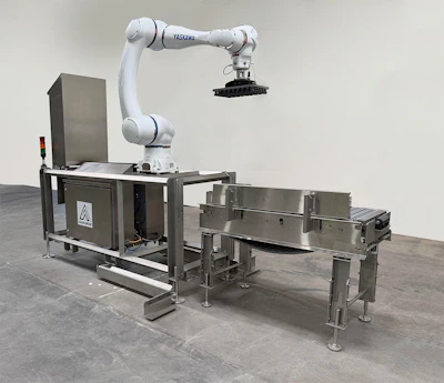 White Yaskawa robotic arm mounted on stainless steel industrial manufacturing machine