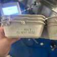 The side of each carton gets a clean, readable lot and date code.