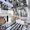 Pine-Glo’s new robotic case-packing system erects, fills, and seals cases in one cell, replacing manual labor while enabling fast, flexible changeovers across multiple product formats.