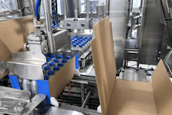 One group of 24 bottles has just been swept onto a corrugated case while the next group is collated and ready to be swept onto the next case.