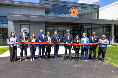 Ribbon holders: Lauren Perez Adler (left) and Vikrant Tandon (right), both of W&H. Pictured left to right: Dr. Sascha Witt (W&H), Kasie Fairbarn (W&H), Lincoln Town Administrator Philip Gould, Rhode Island State Senator Thomas Paolino, Andrew Wheeler (W&H), Rhode Island Secretary of Commerce Stefan Pryor, Lincoln Councilwoman Pamela Azar, Rhode Island State Representative MaryAnn Shallcross Smith, and Kasif Baig (W&H).