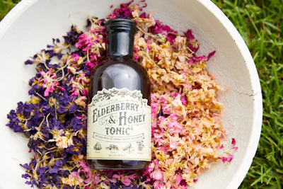 Roots & Leaves’ Elderberry & Honey Tonic, packaged in a glass bottle with apothecary-inspired graphics, reflects the brand’s focus on ingredient integrity, sustainability, and traditional herbal remedies.