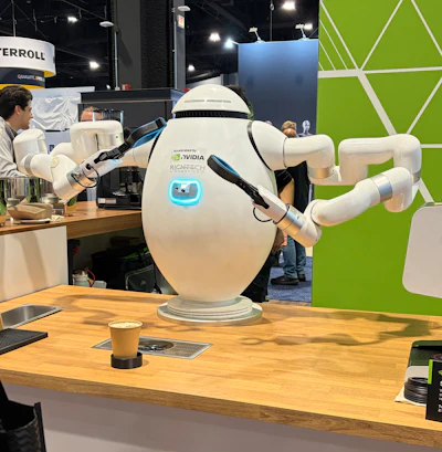 Richtech Robotics’ ADAM, a two-armed barista accelerated by NVIDIA, serves coffee at the Humanoid Robot Pavilion during Automate 2026 in Chicago.