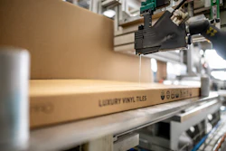 Robatech applicators apply hot melt adhesive to seal Fatra’s LVT flooring cartons.