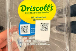 A Driscoll's blueberry clamshell carrying two QR codes — one pre-printed on the brand label, one applied at the farm. Together they're central to a serialization program that has given more than a billion packages a unique, traceable identity.
