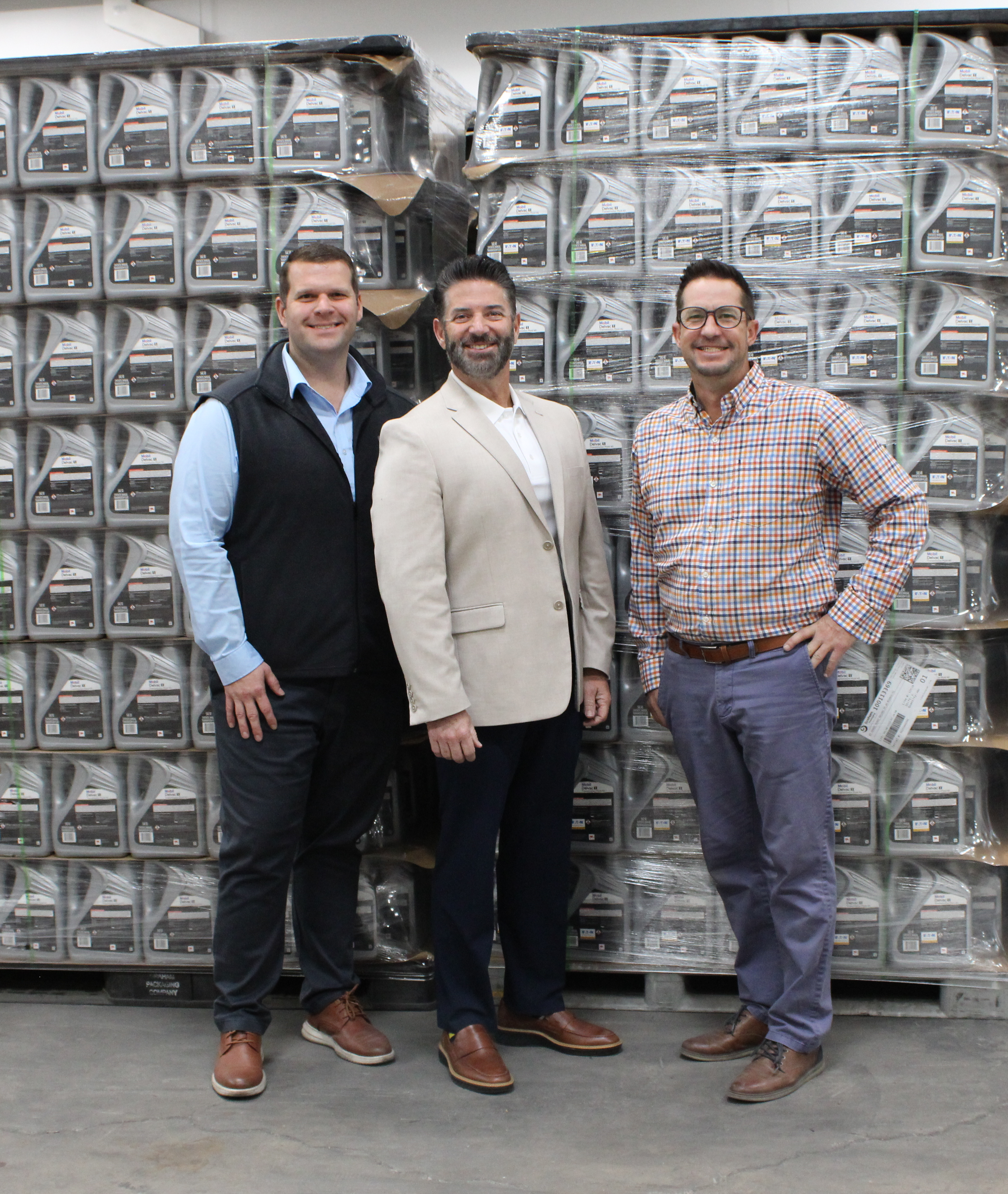 From left: Mark Goryl, vice president; Tony Barrett, CEO; and Keith Coffindaffer, business development specialist, stand in front of palletized product at RISE Packing & Assembly Co.'s Orland Park, Ill., facility.