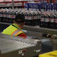 A line operator monitors product at a Coca-Cola Consolidated facility. MUST's real-time data has helped operators and maintenance teams identify equipment issues faster and with less wasted film.