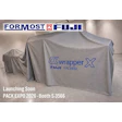 Formost Fuji Wrapper X FW3400 machinery covered with gray fabric at Pack Expo 2026 booth S-3566