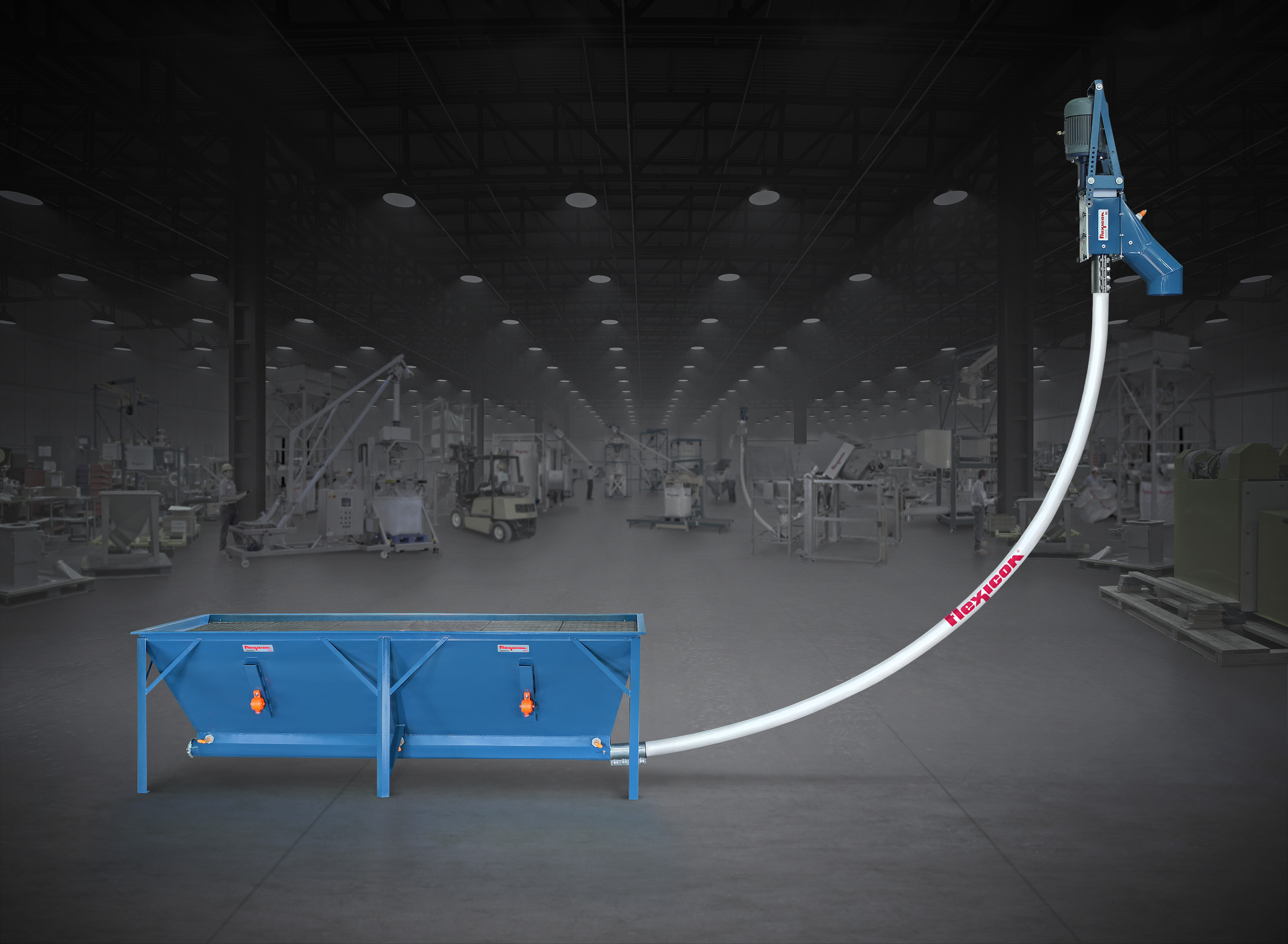 This Flexicon flexible screw conveyor with trough hopper can receive material from multiple outlets of feeders, grinders, blenders, bulk bag dischargers, or any process equipment with a wide-style discharge.