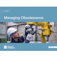 Technician in hard hat and safety gloves working on yellow industrial machinery with PMMI Business Intelligence branding