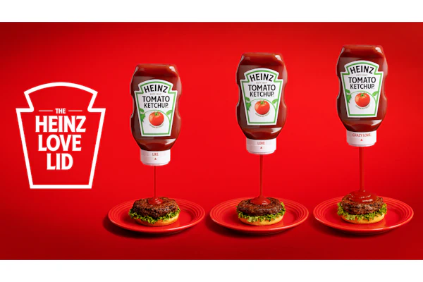 Rotating the Love Lid's dial raises an internal core away from a small inner aperture to widen flow. The two-part closure is molded from standard Heinz polypropylene, so recyclability is maintained.