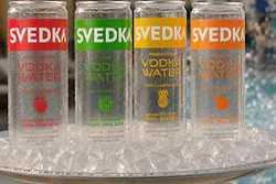The transparent can is designed to showcase the product's composition, which includes vodka, purified water and fruit flavoring, while reinforcing visual clarity as a key packaging feature.
