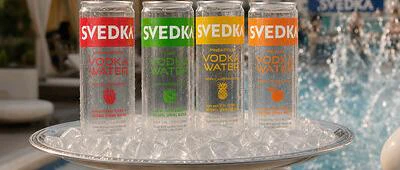 The transparent can is designed to showcase the product's composition, which includes vodka, purified water and fruit flavoring, while reinforcing visual clarity as a key packaging feature.