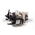 Thermal label printer with paper roll and control panel mounted on beige base