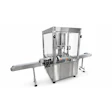 Industrial automatic filling and capping machine with stainless steel frame and clear protective enclosure