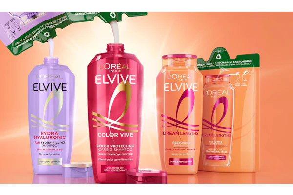 L'Oréal Elvive haircare product collection including purple hydra shampoo, burgundy color vive shampoo, and coral dream lengths conditioner bottles on gradient background