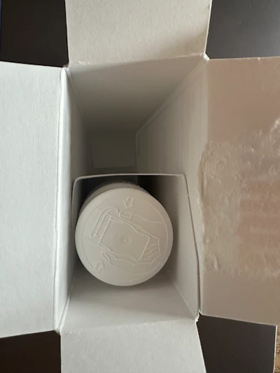 An inner fitment braces the roll-on stick inside the carton.