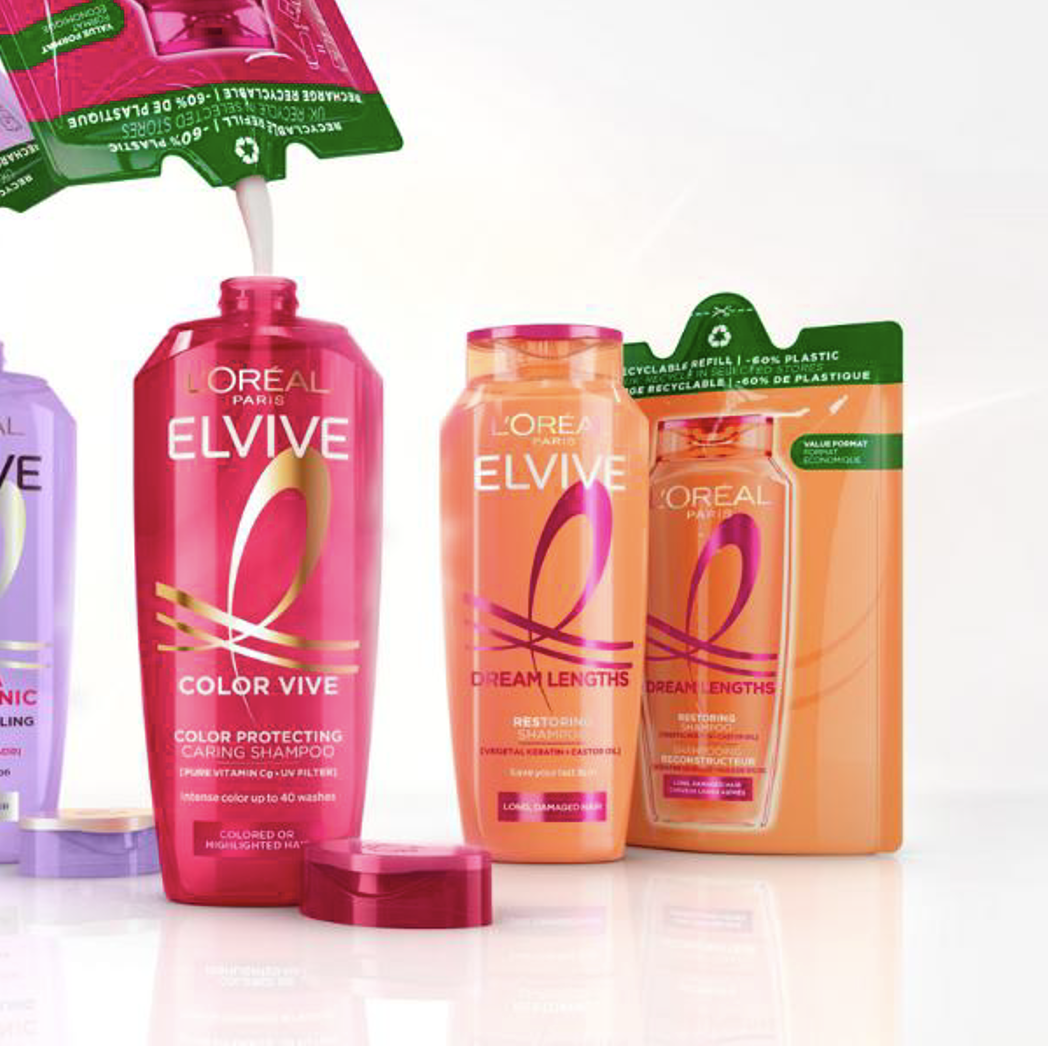 L'Oreal Elvive hair care products including Color Vive shampoo and Dream Lengths conditioner in pink and orange bottles