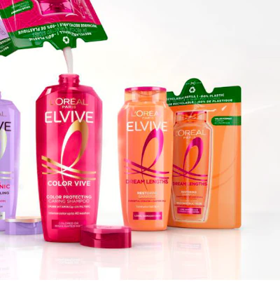 L'Oreal Elvive hair care products including Color Vive shampoo and Dream Lengths conditioner in pink and orange bottles