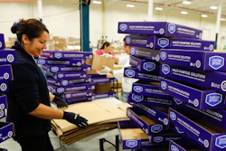A Sterling CPI worker prepares trays for product loading. The contract packager's approach to streamlining healthcare packaging is being featured on 'All Access' with Andy Garcia, a public television series.