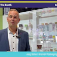 Jorg Sabo from Greiner Packaging Corporation speaking live at Pack Expo booth W-46052 with product display cases behind him