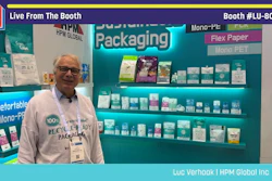 Man in glasses at sustainable packaging booth displaying eco-friendly mono-PE and flex paper products at Pack Expo trade show booth LU-8027