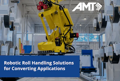 Yellow industrial robotic arm handling rolls in manufacturing facility with AMT branding