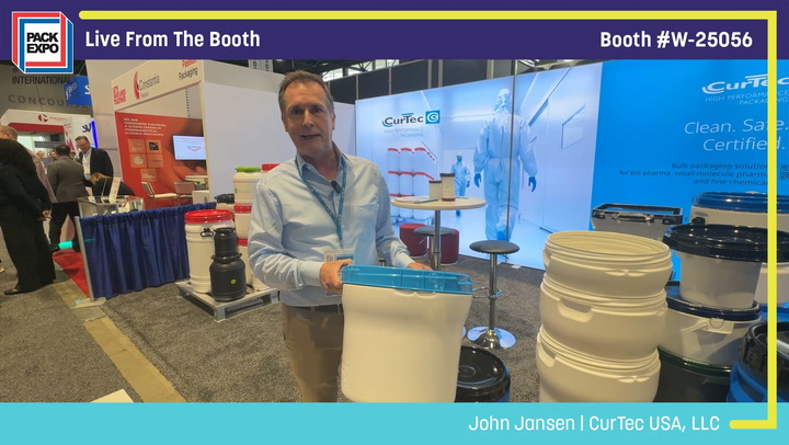 Man presenting CurTec USA products at Pack Expo booth W-25056, displaying storage containers and equipment