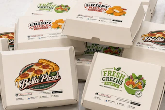 Collection of branded food delivery boxes including Bella Pizza, Crispy Chicken, and Fresh Greens salad packaging arranged together