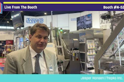 Professional man in beige blazer at Trepko Inc. trade show booth N-5239 with industrial equipment and branding displays