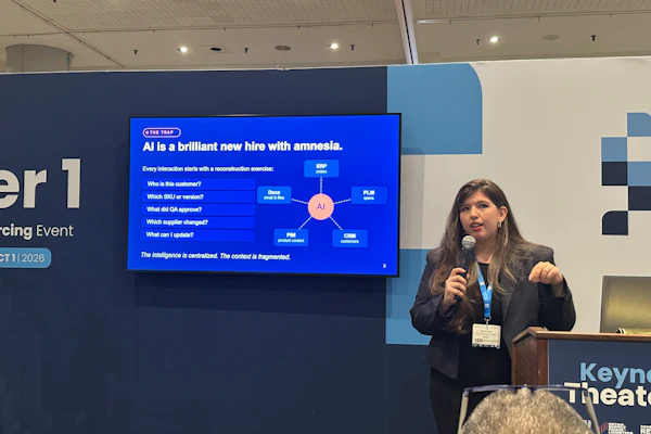 Professional woman presenting at conference with AI diagram on screen behind podium